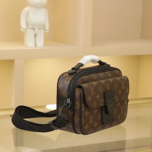 Alternative view of This S Lock messenger bag is crafted from Monogram Macassar canvas, featuring a new lock inspired by Georges Vuitton's 1886 trunk lock design. A special finishing process lends this magnetic metal lock a striking, modern look. It also includes a spacious zippered compartment, trunk-style leather handles, and an LV monogram shoulder strap, combining style with ease of use.Monogram Macassar coated canvas with Epi leather trim and matte black metal hardware lining - Leather handles with V-stitching and embossed logo - S-shaped magnetic clasp - Large front pocket - Large zippered compartment - Interior slip pocket - Detachable, adjustable shoulder strap!! Dimensions: 22x18x8CM